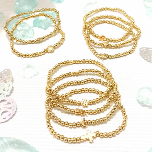 Juego de pulseras esfera dorada