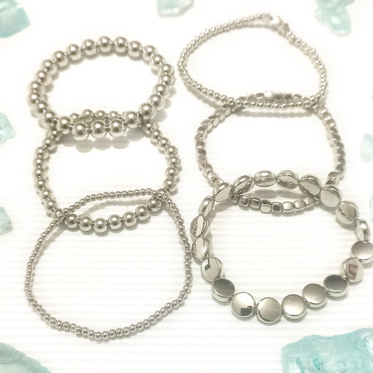 Juego de pulseras esfera plata