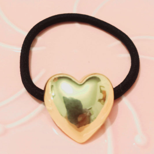 Sujetador de cabello corazón dorado