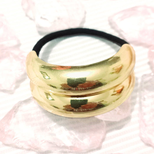 Sujetador de cabello placas doradas