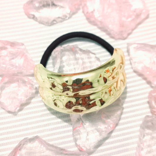 Sujetador de cabello textura dorada